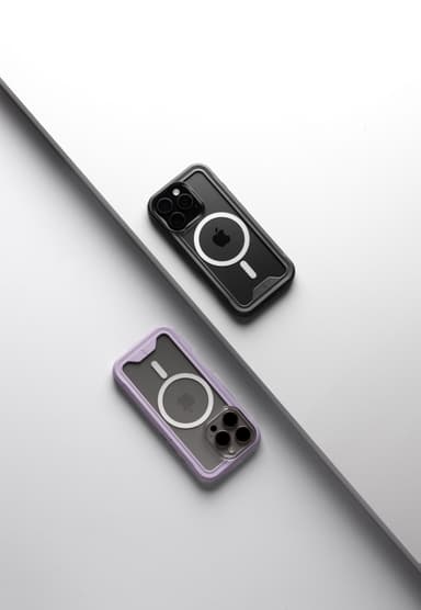 A black-bumper and a purple-bumper ZIZO ION MagSafe case lying rear-facing across a graphic gray and white diagonal