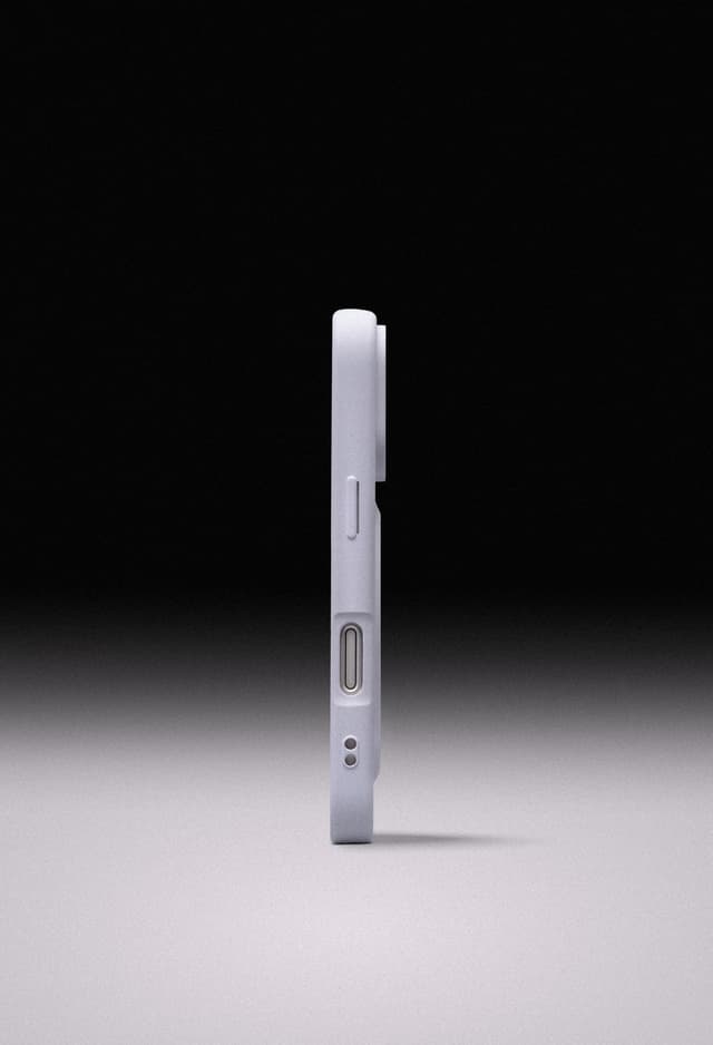 Side profile of the lavender ZIZO Revolve case showing the molded button covers and raised lip