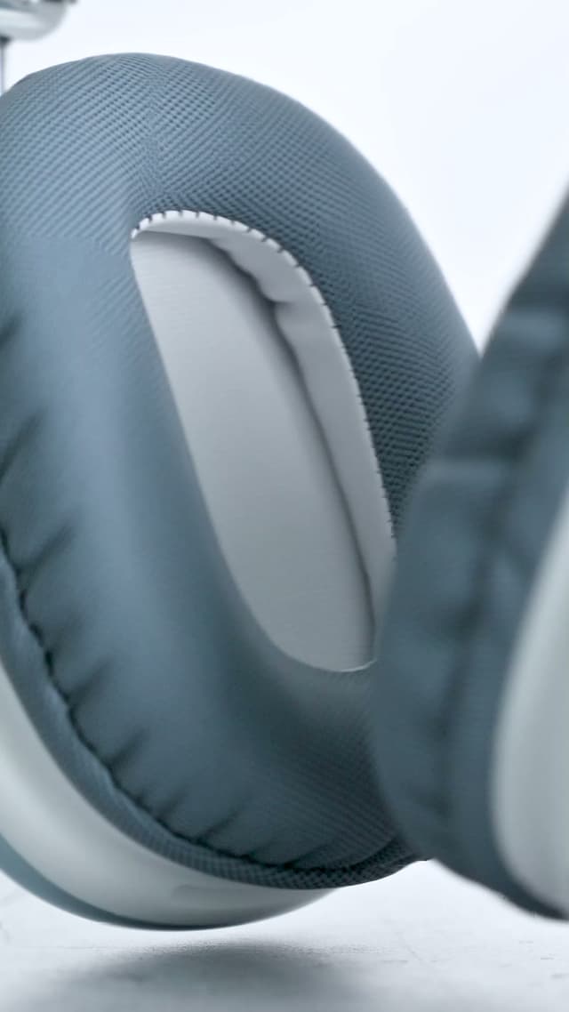 A macro view of the cushion ring on a pale ZIZO Tempo Pro earcup, its stitched outer edge and the softer inner panel