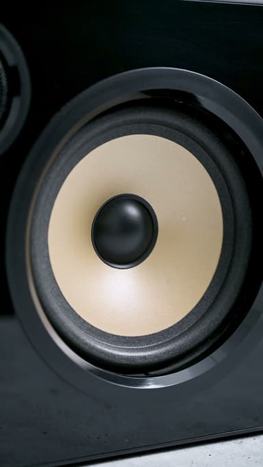 Extreme close view of the ZIZO Retro boombox's cream woofer cone and black surround