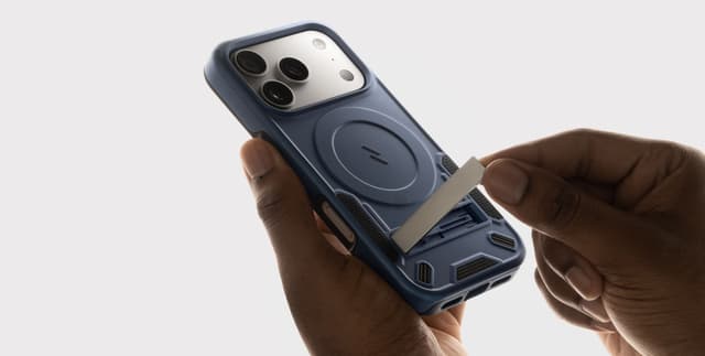 Macro of hands sliding the built-in kickstand out of a blue ZIZO Transform MagSafe case