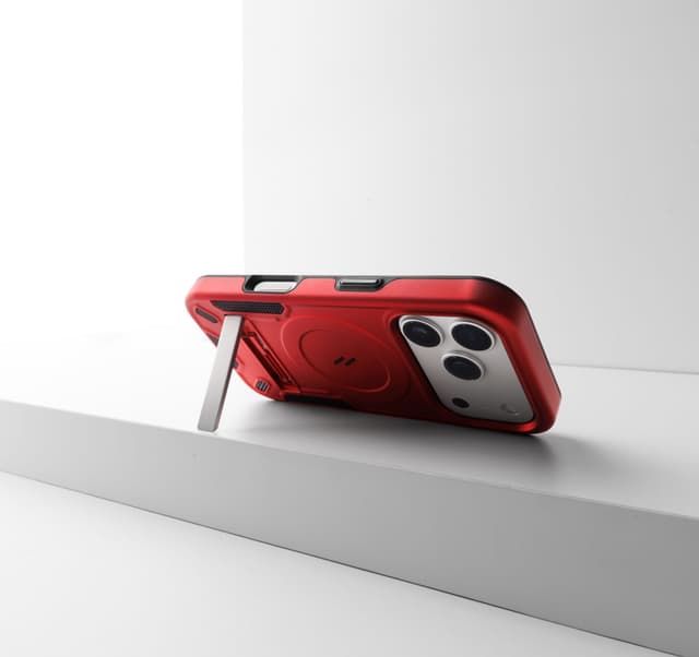 A red ZIZO Transform case shot at a low angle on a white studio pedestal with its kickstand fully deployed