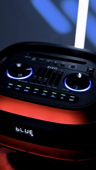 The ZIZO Boom speaker's top control deck, twin jog wheels ringed in blue above lit function buttons and EQ sliders