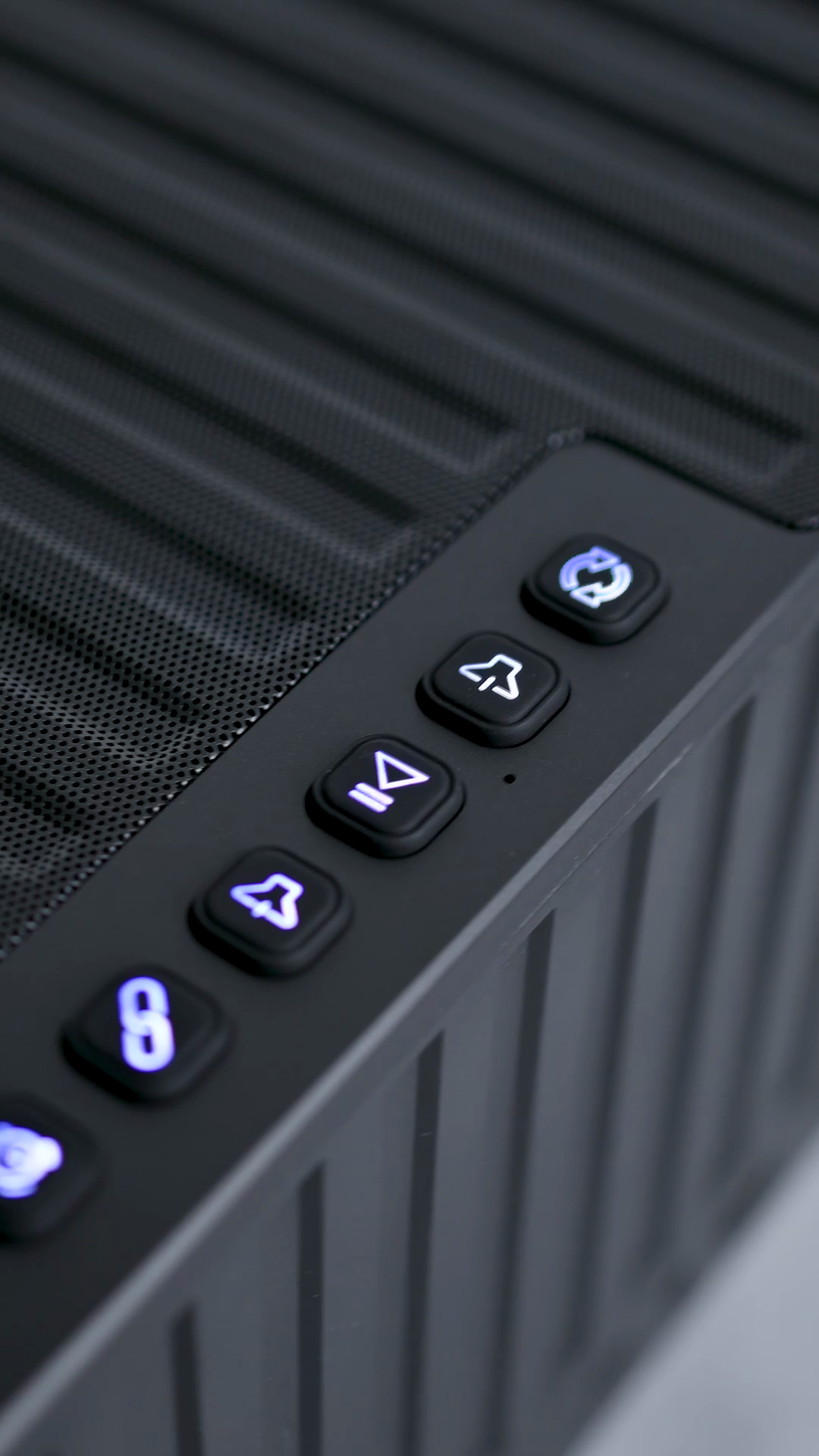 The rubber playback and Bluetooth buttons on the ribbed top panel of the ZIZO Retro Crystal speaker