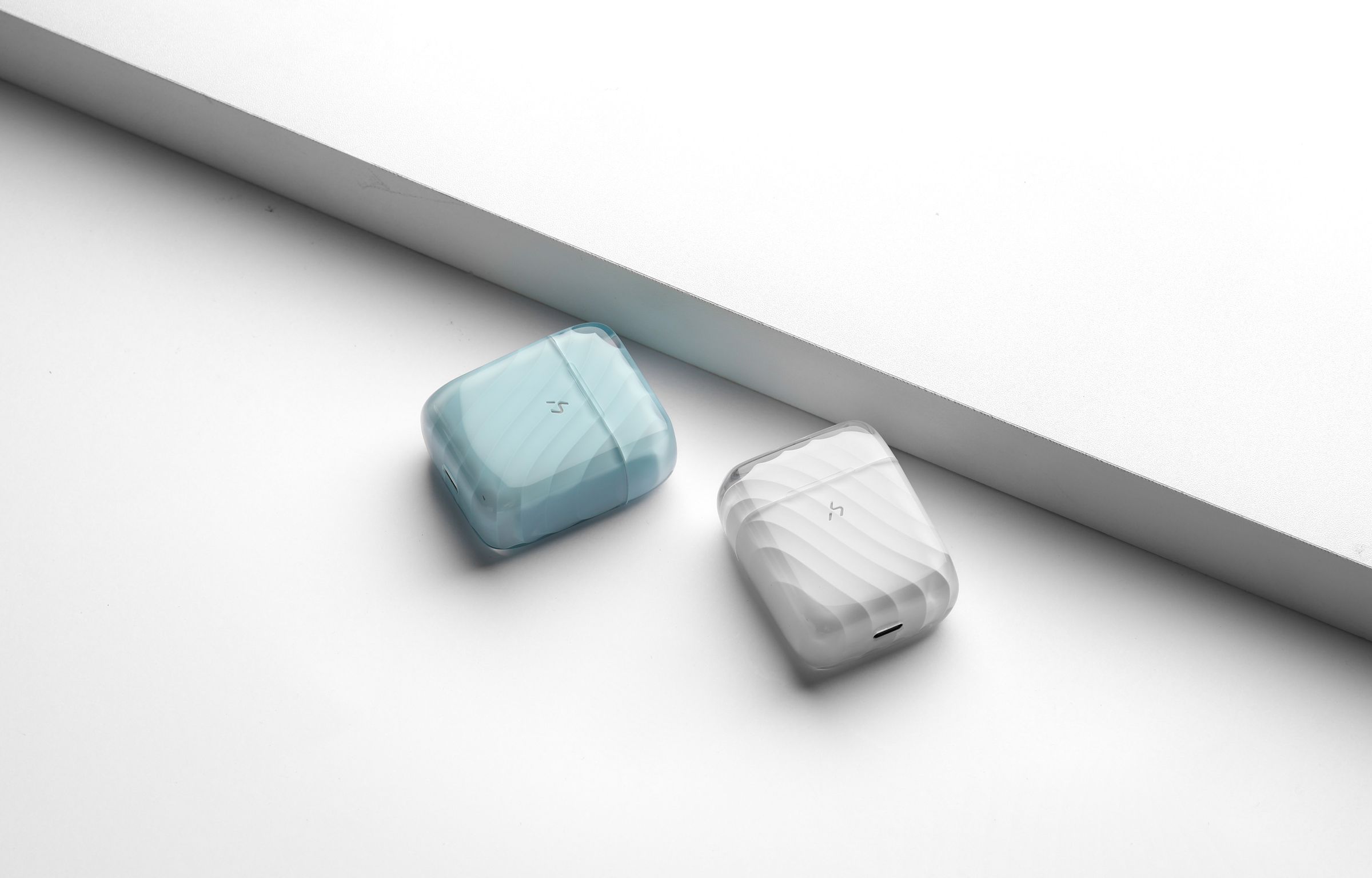A pale blue and a frosted ZIZO Halos case lined up on a pale surface