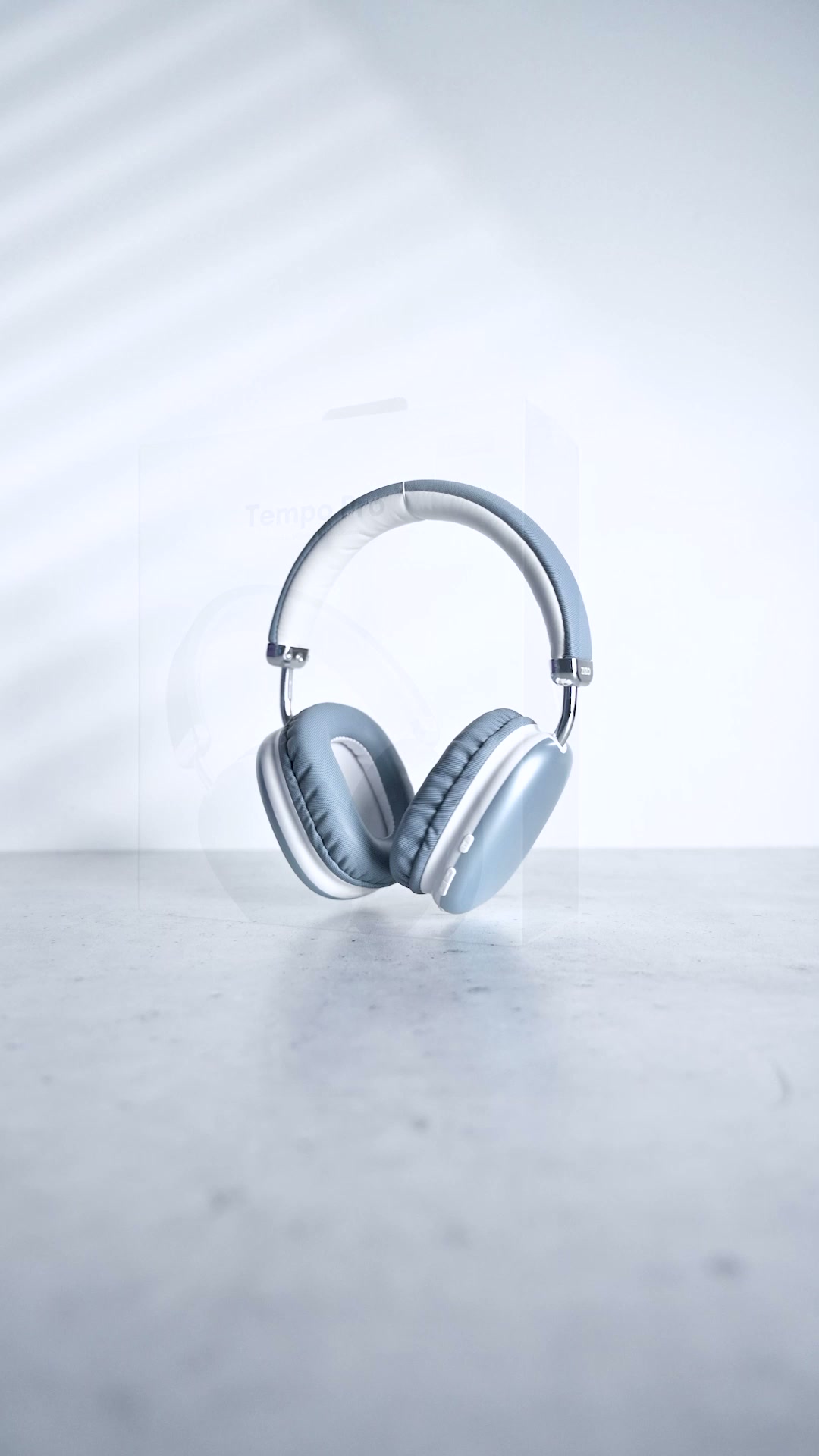 A pale ZIZO Tempo Pro headset standing upright on a concrete slab against a bright wall